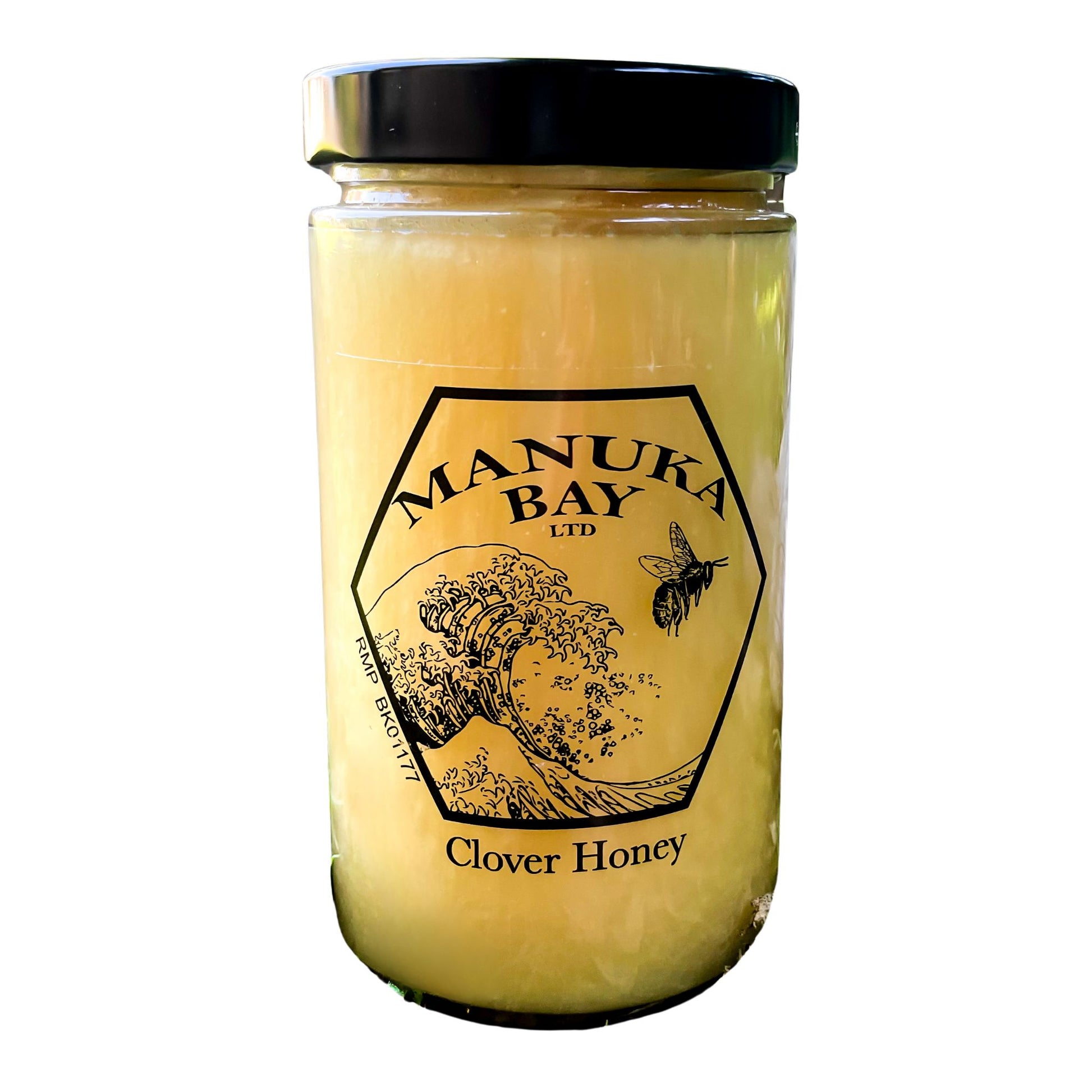 Glass jar with black lid filled with Manuka Bay Clover Honey.