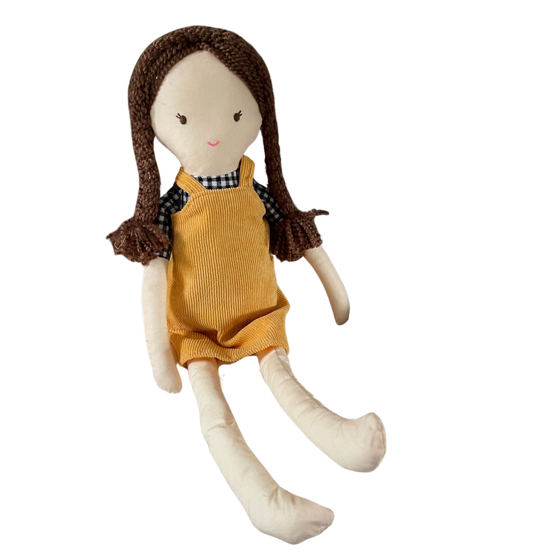 Arabella doll soft toy. Cute little ragdoll style soft toy with brown platted hair. She is wearing a checkered black and white shirt and mustard coloured corduroy dress.