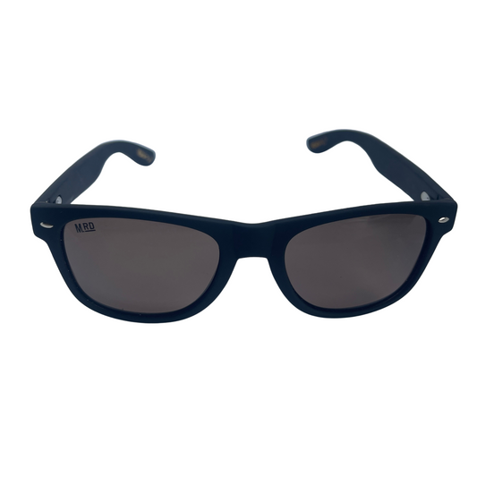 Sunglasses with dark wooden arms, black frames and dark lenses.