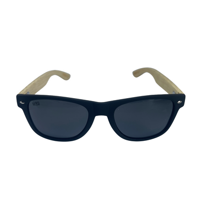 Sunglasses with wooden arms, black frames and dark lenses.