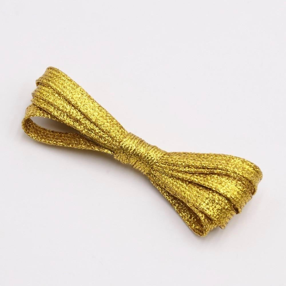 Gold metallic shoelaces.