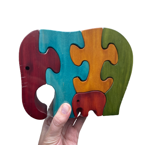 Coloured wooden elephant puzzle with adult and baby elephants.