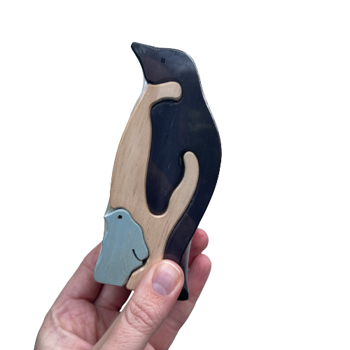 Wooden penguin puzzle with an adult and chick penguin.