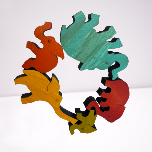Wooden coloured balancing elephants.