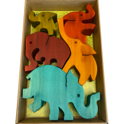 Box of large coloured wooden balancing elephants.