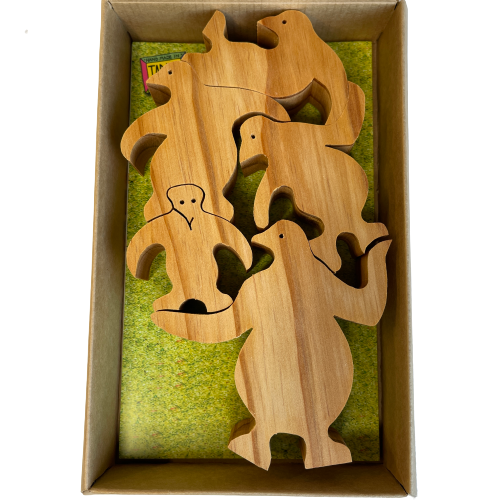 Box of natural wooden balancing penguins.