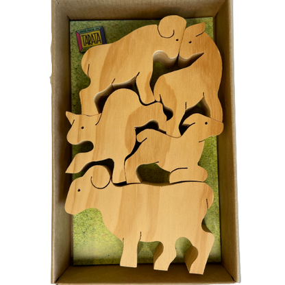 Box of natural wooden balancing sheep.