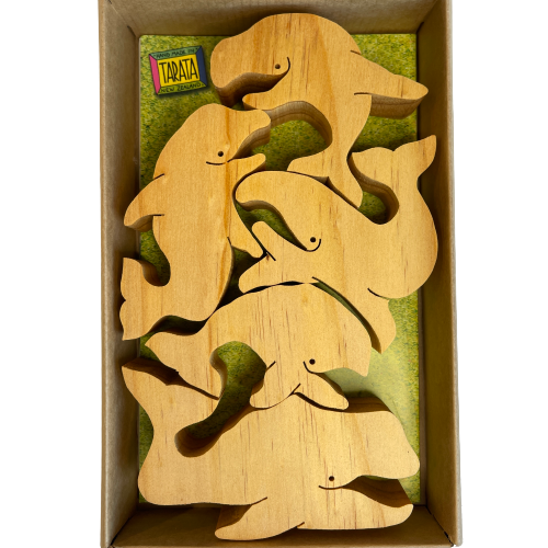 Box of natural wooden balancing whales.