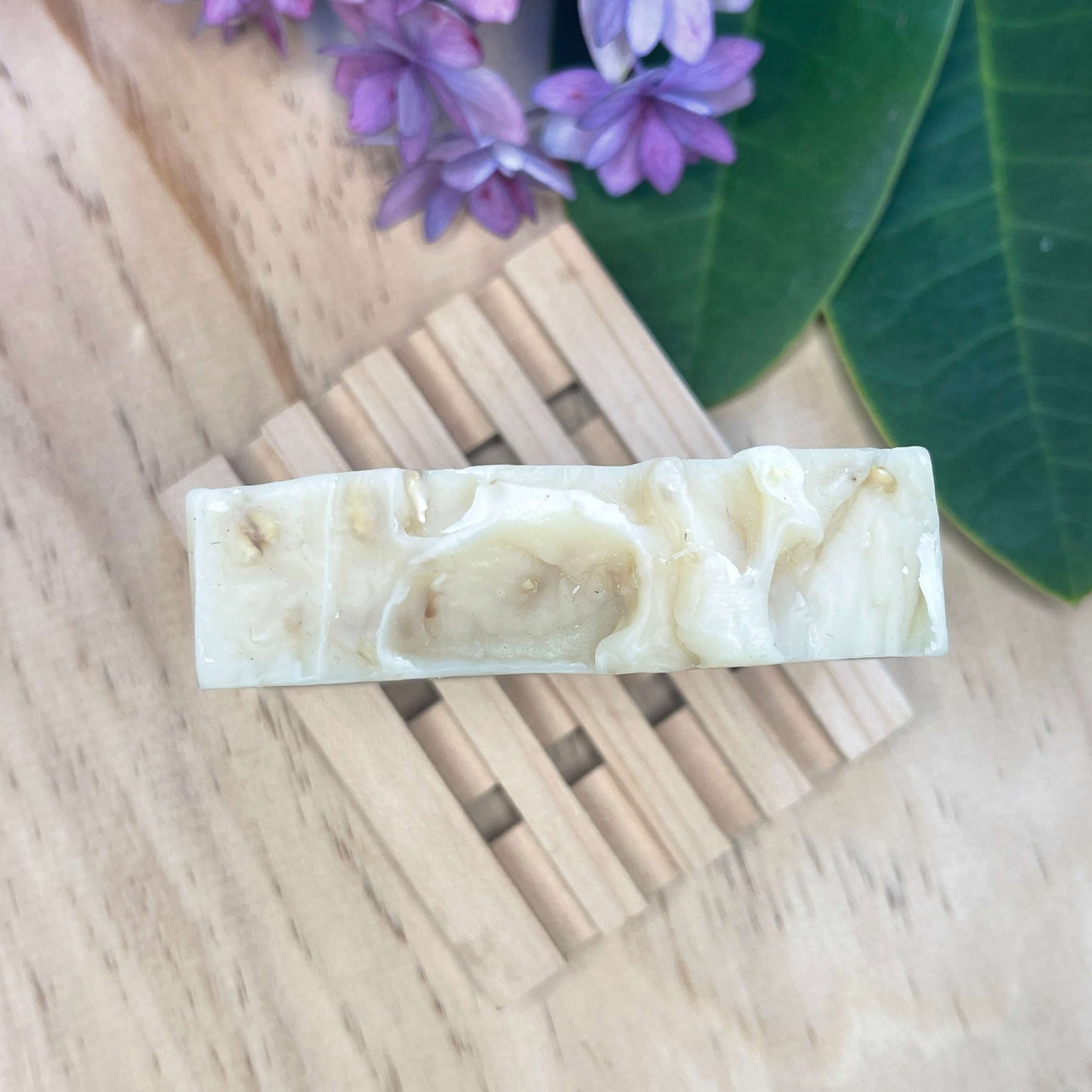 Natural soap on a wooden soap rack.