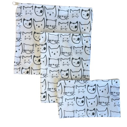 Set of 3 white reusable bags with black cat faces print.