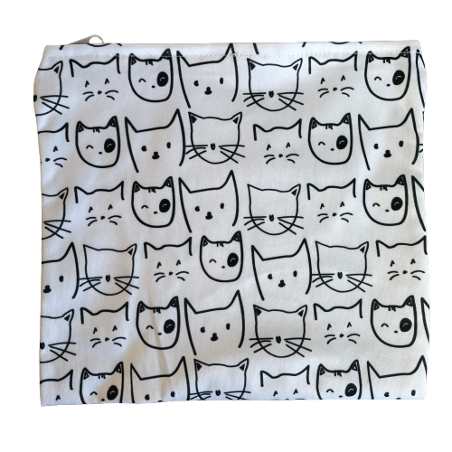 White reusable bag with black cat faces print.