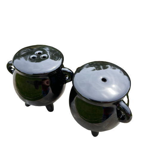 Black ceramic cauldron shaped salt and pepper shaker set.