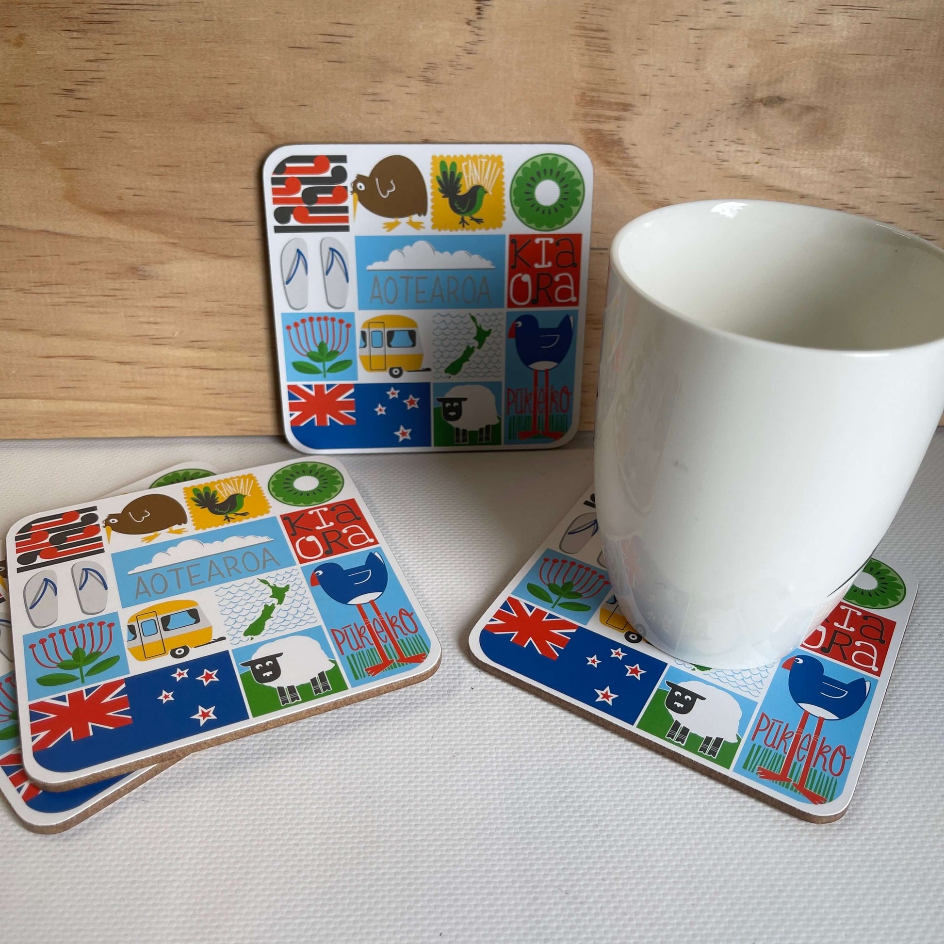Set of four coasters featuring kitsch style Kiwiana images.