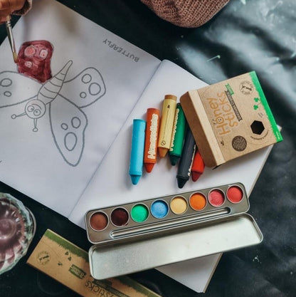 Honeysticks paints and crayons being used by a child.