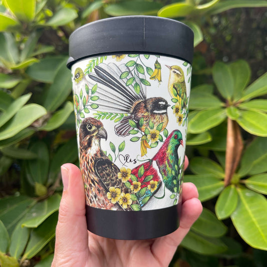 Black reusable coffee cup wrapped with beautiful drawings of New Zealand birds.