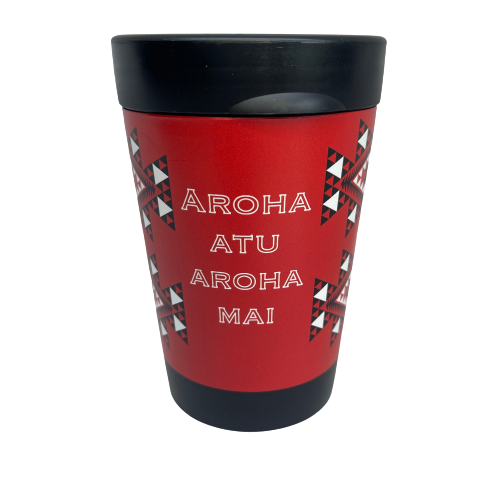Reusable coffee cup in black with red, white and black wrapped image featuring Maori patterns and the words Aroha Atu Aroha Mai.