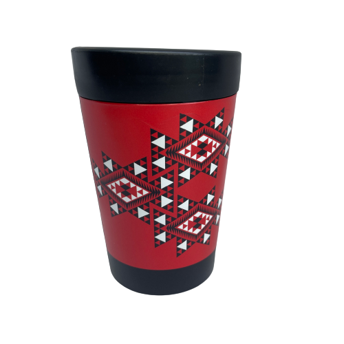 Reusable coffee cup in black with red, white and black wrapped image featuring Maori patterns.