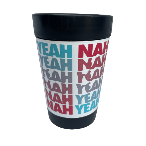 Black reusable coffee cup with white wrap and pink and blue words saying Yeah Nah.