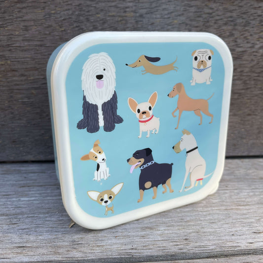 Trio of snack boxes with dogs printed on the lids.