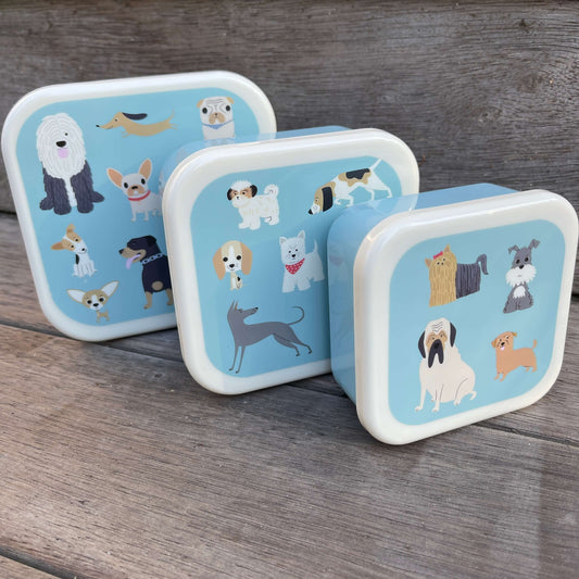 Trio of snack boxes with dogs printed on the lids.