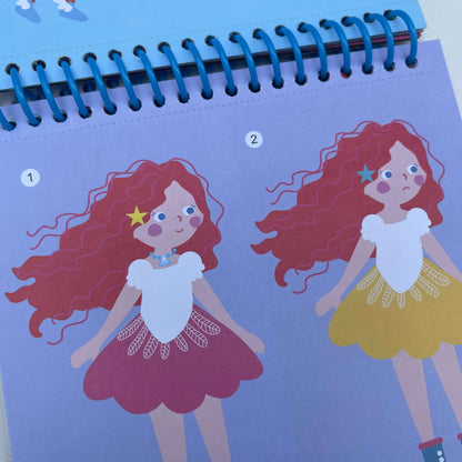 picture of two girls inside dress up fun activity book.