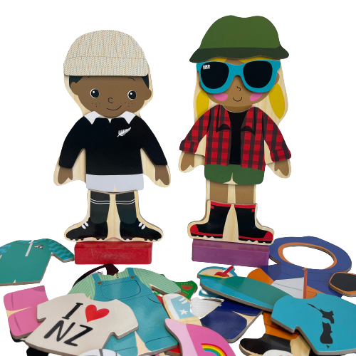 Wooden magnetic kids dress up figurines and various additional clothing pieces.