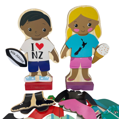 Wooden magnetic kids dress up figurines and various additional clothing pieces.