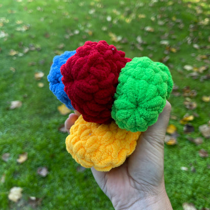 Reusable water balloons held in a persons hand.