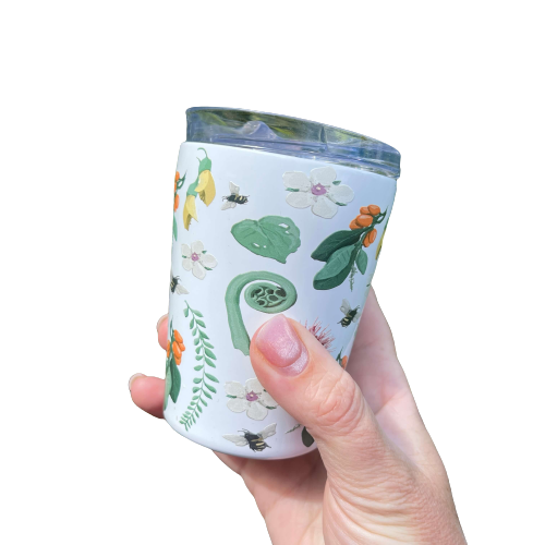 White reusable coffee mug with native New Zealand flora and fauna print.