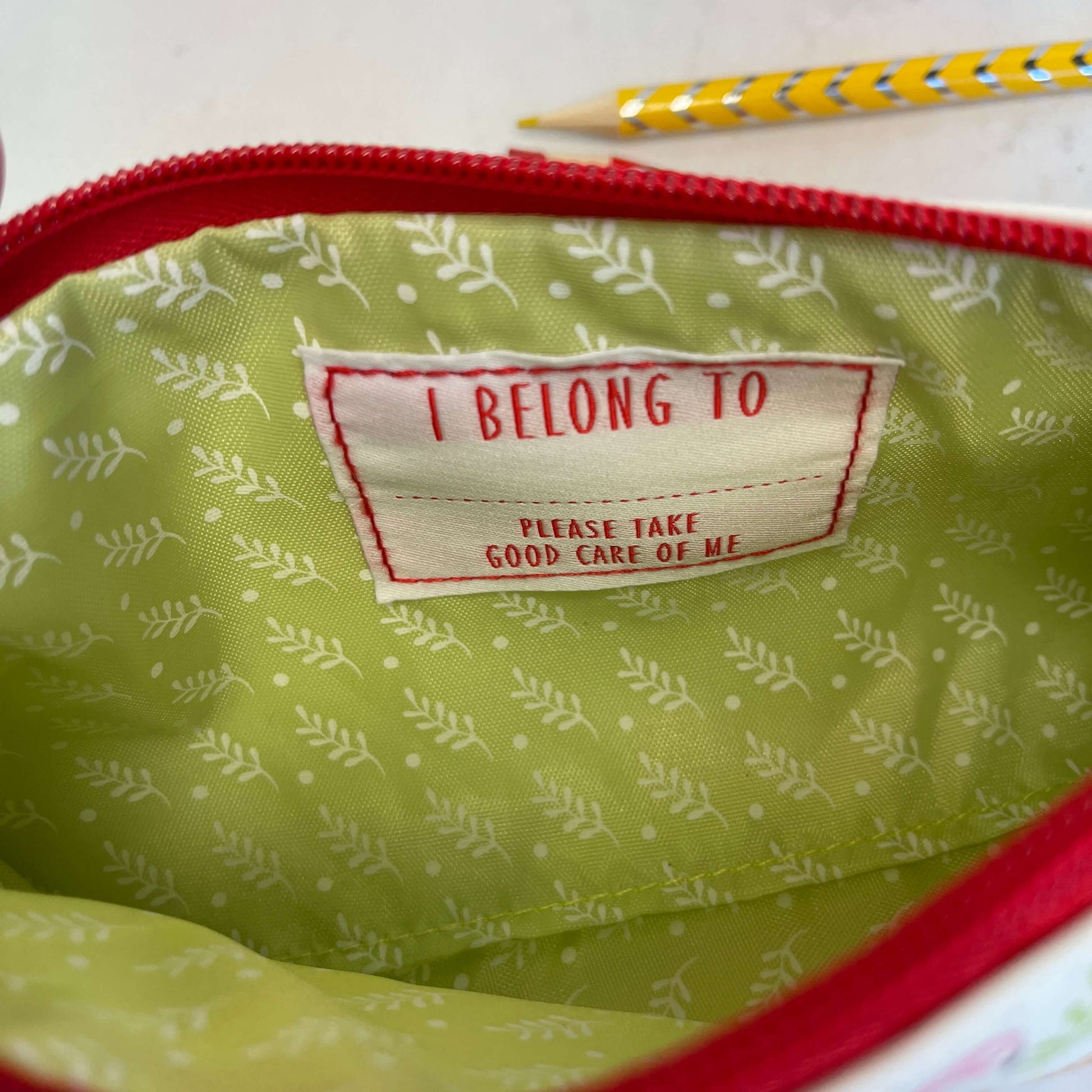 I belong to label sewn inside kids pencil case.