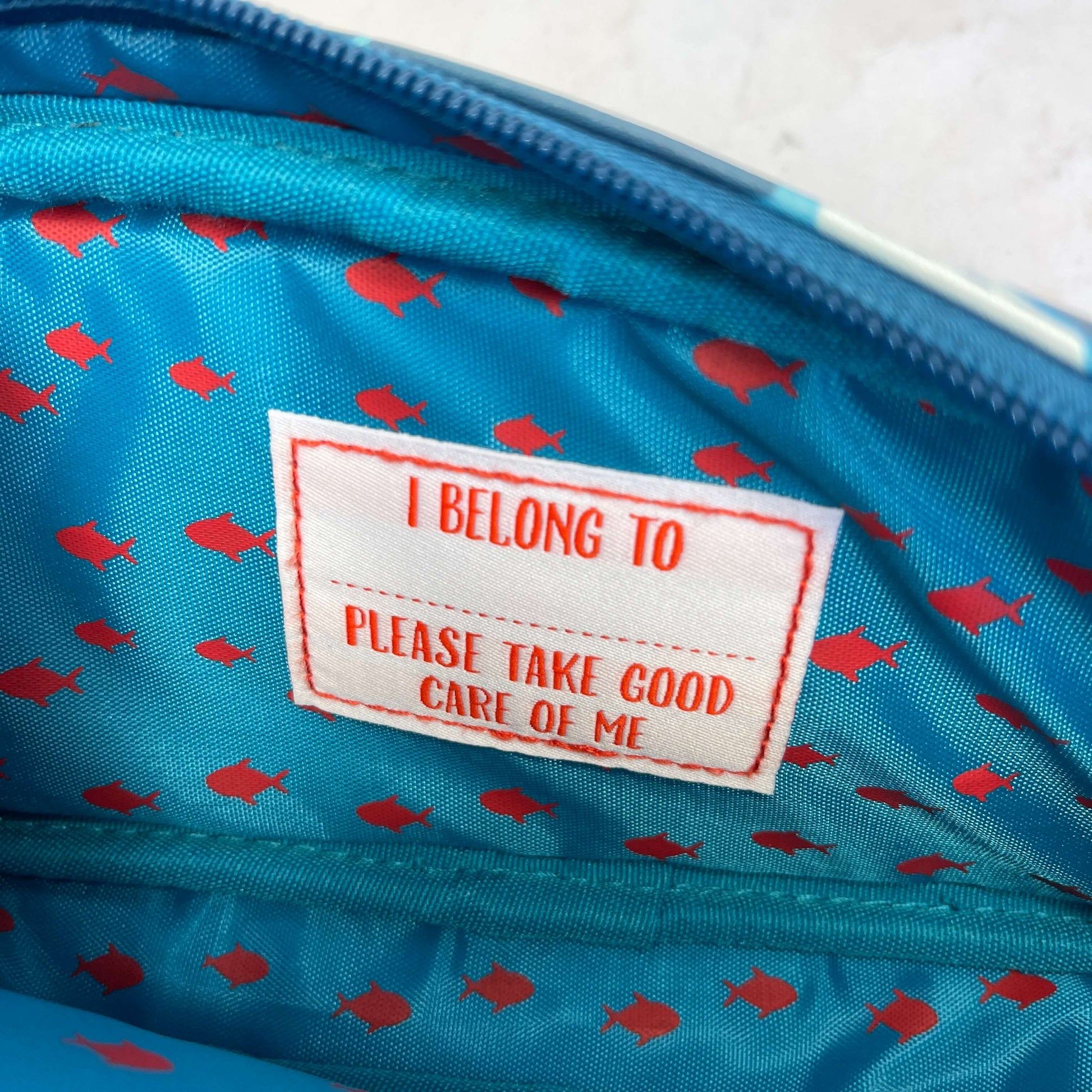 I belong to label sewn inside kids pencil case.