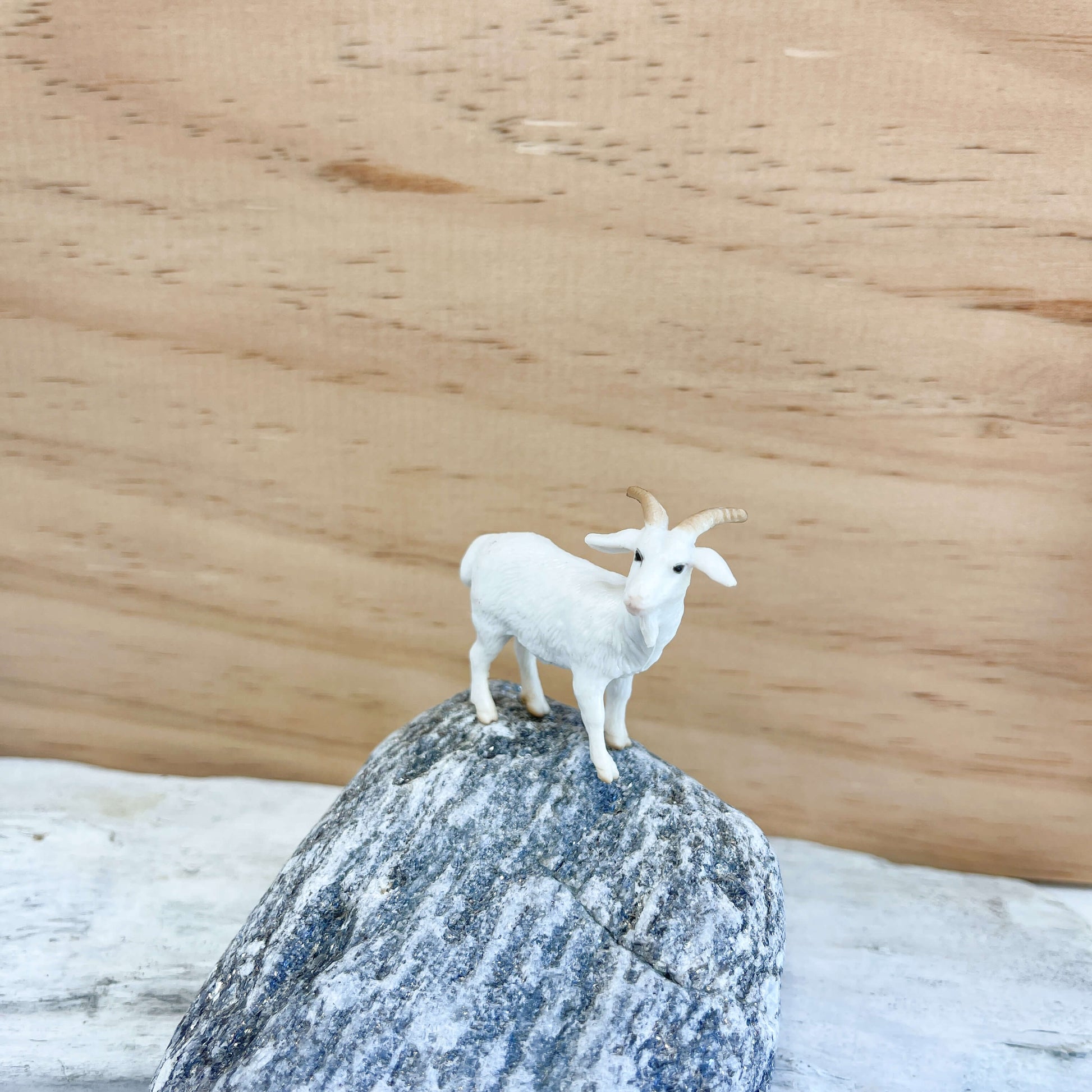 Mini goat figurine.