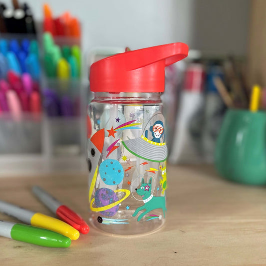Kids drink bottle with spaceships and astronauts printed on it. Features a red lid with clear sipping tube.