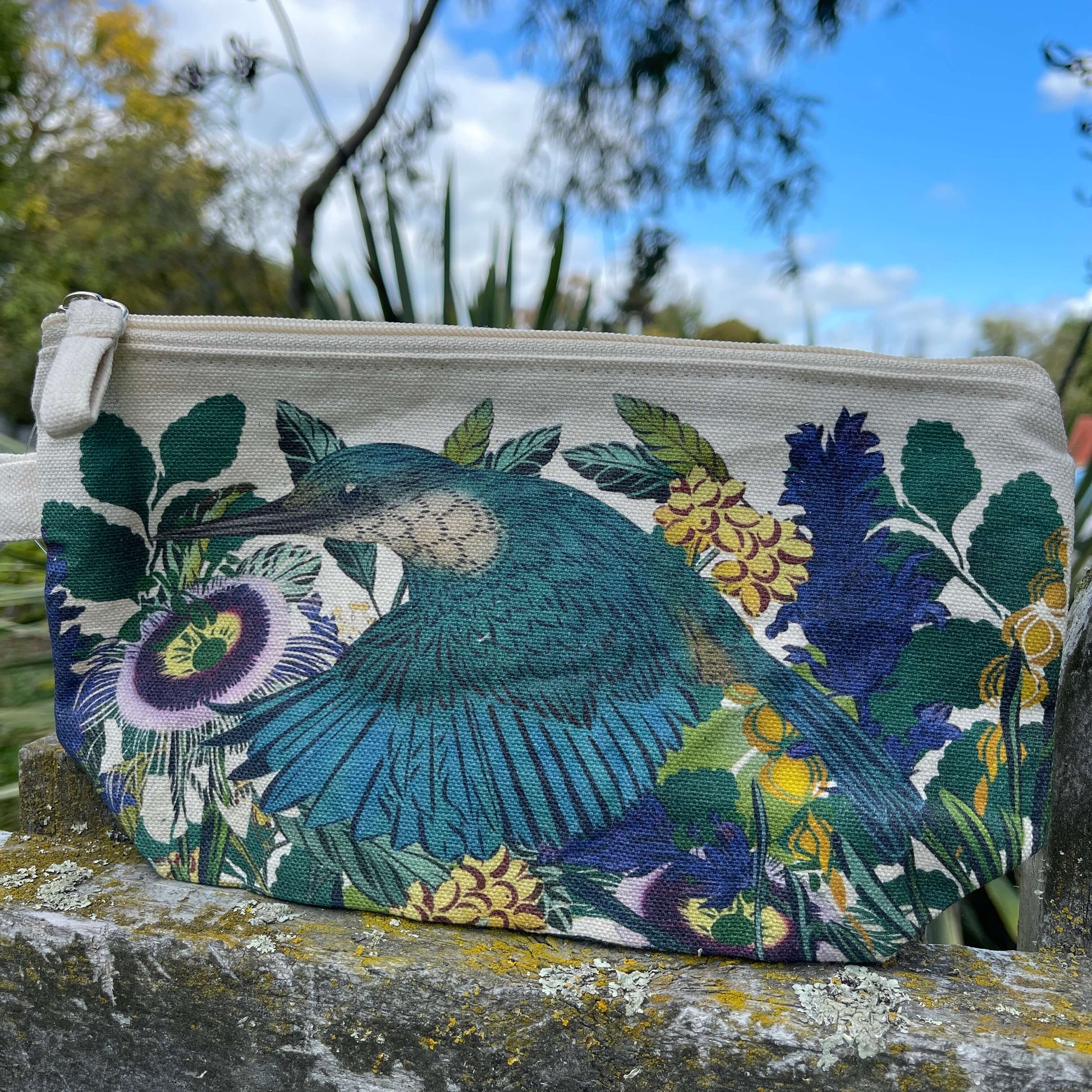 Vibrant kingfisher print on a cotton clutch purse.