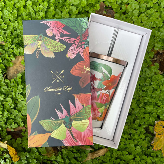 Stainless steel smoothie cup with rose gold lid and straw. Featuring a floral design by artist Flox. Presented in a deluxe box with the same design as the cup.