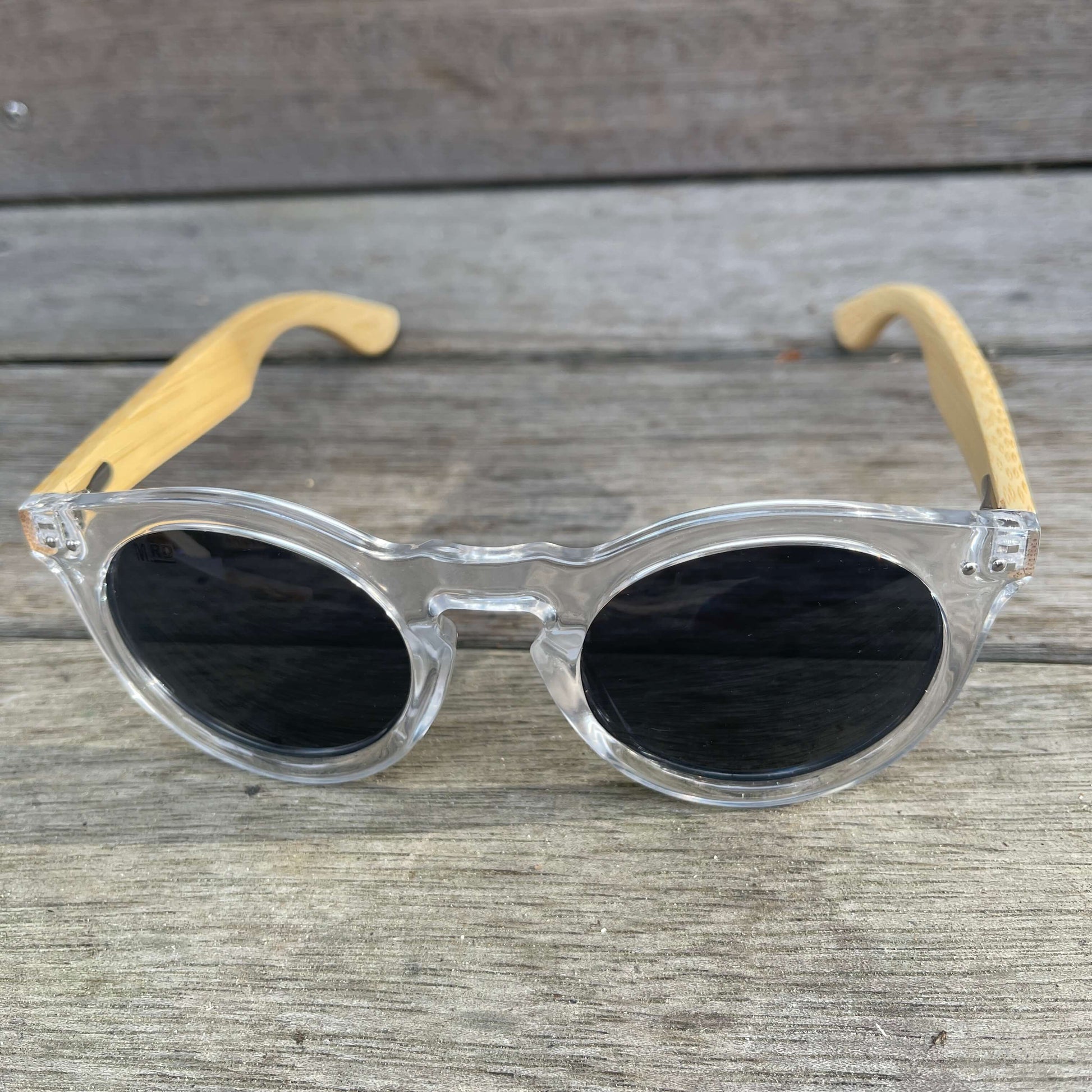 Womens sunglasses with clear frames and bamboo arms in a Grace Kelly style.