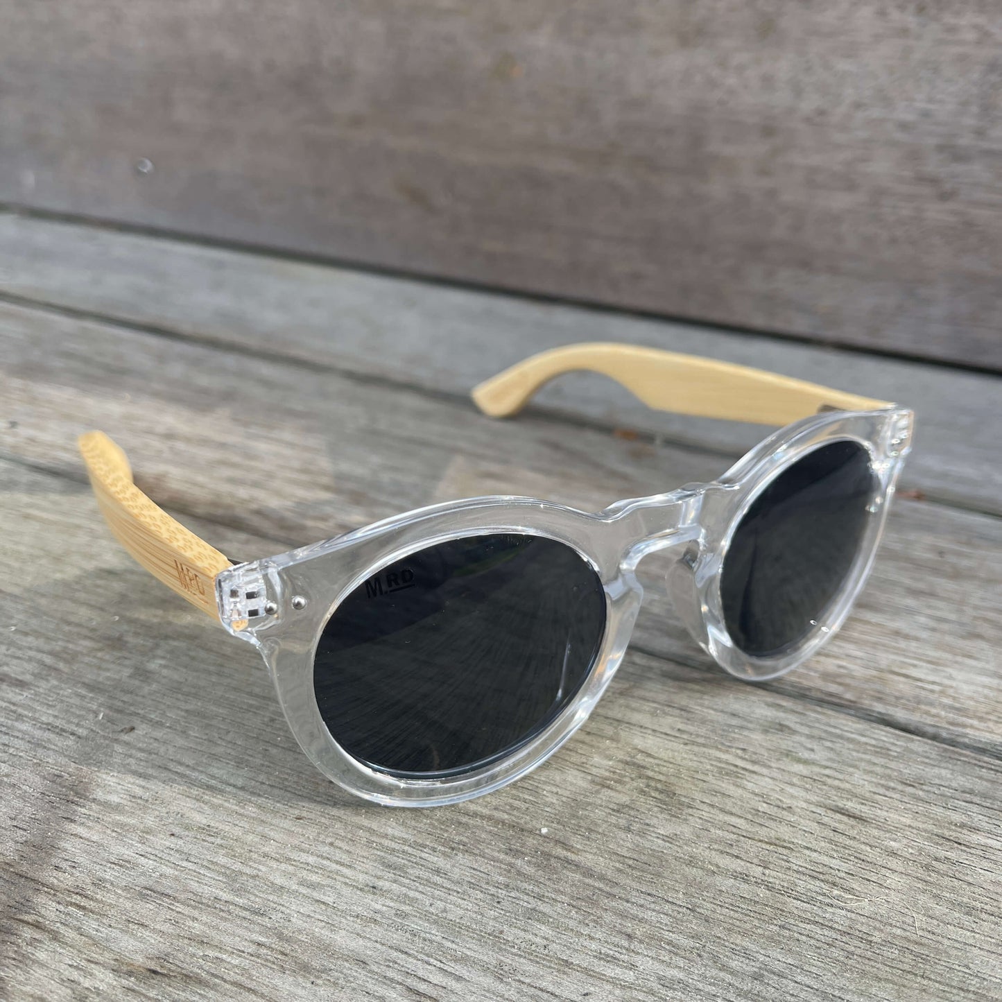 Womens sunglasses with clear frames and bamboo arms in a Grace Kelly style.
