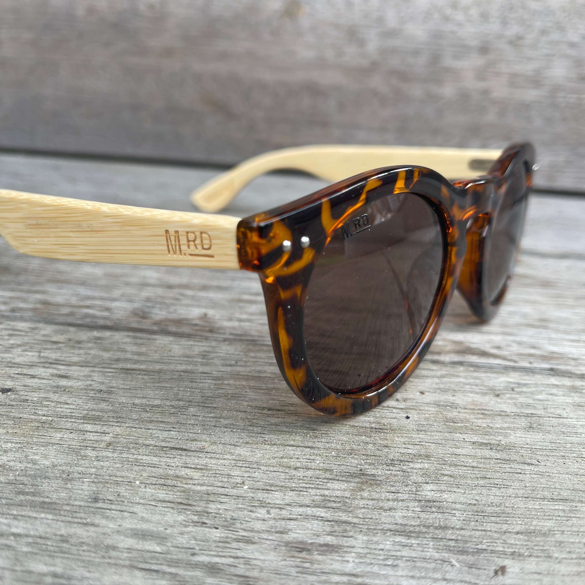 Womens sunglasses with brown tortoiseshell frames and bamboo arms in a Grace Kelly style.