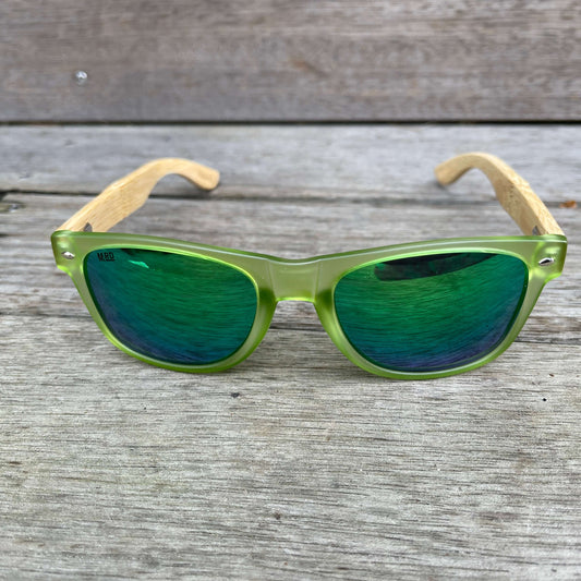 Sunglasses with wooden arms, green frames and reflective lenses.