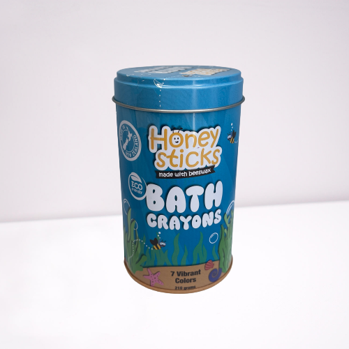 Bath crayons by Honey Sticks in a blue storage tin.
