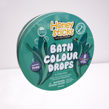 Honey Sticks bath colour drops in a tin.