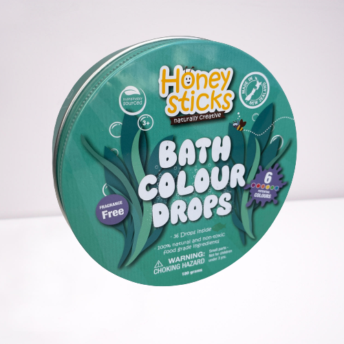 Honey Sticks bath colour drops in a tin.