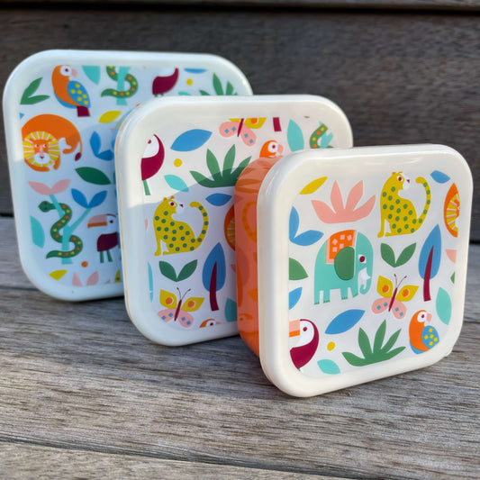 Trio of snack boxes featuring jungle animals on the lids.