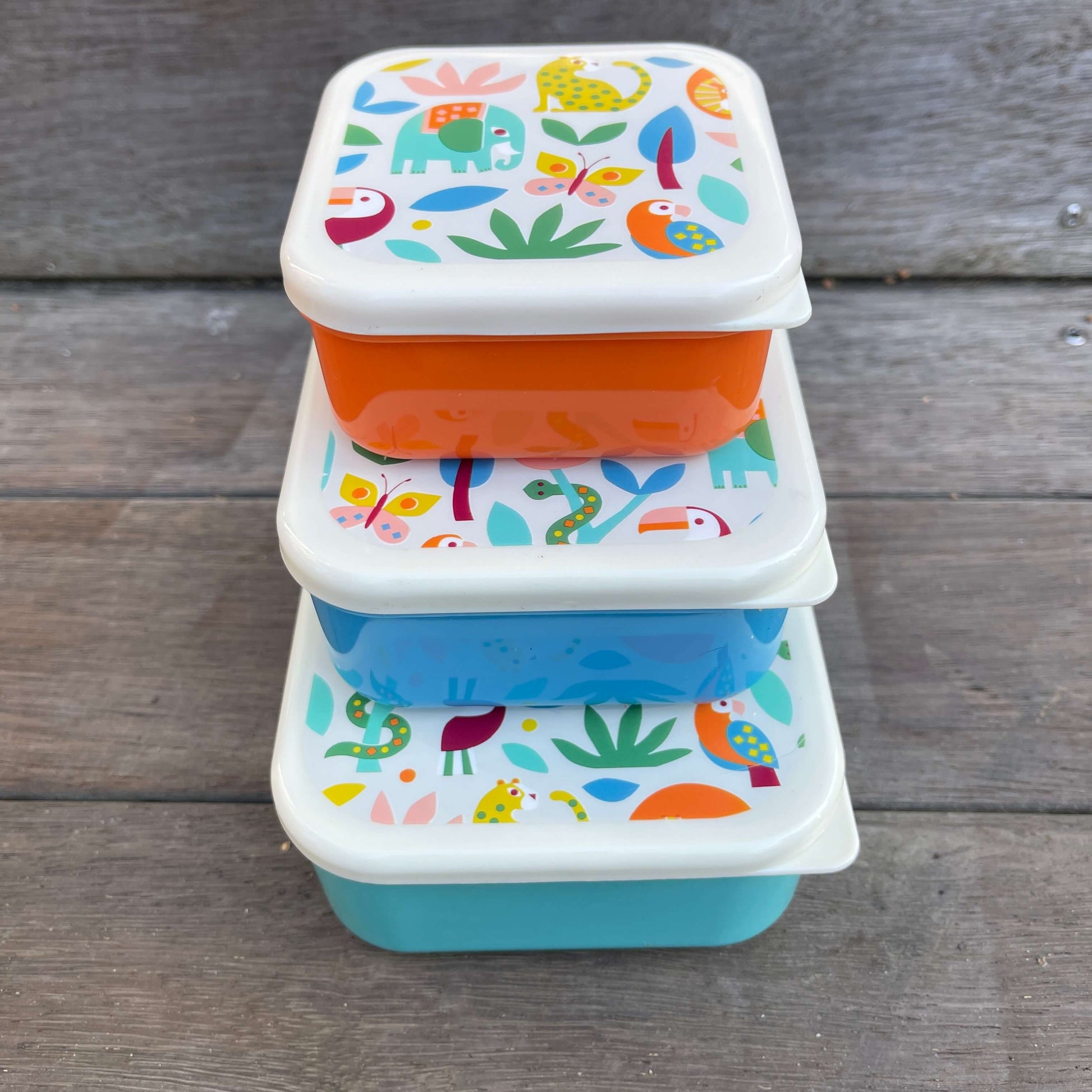 Trio of snack boxes featuring jungle animals on the lids.