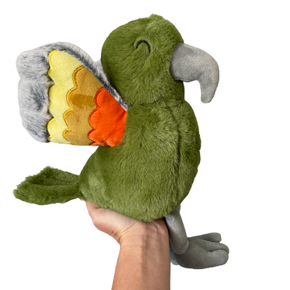 Soft toy Kea in a dusky green with orange and grey wings.