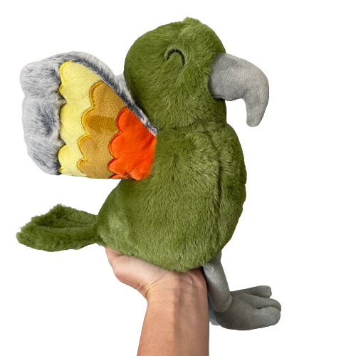 Soft toy Kea in a dusky green with orange and grey wings.