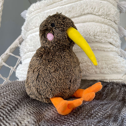 Soft toy Kiwi bird in brown with yellow beak and orange feet.