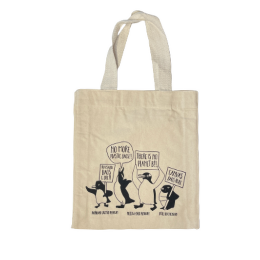 Canvas tote bag with penguins protesting about saving the planet.