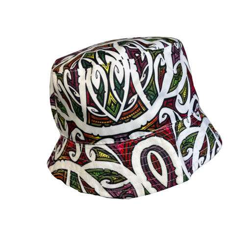 Bucket hat in bright colours with koru patterns in white printed on it.