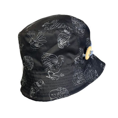 Black bucket hat with white outlines of NZ birds.